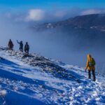 Group Trekking to Sunset Mountain Hill